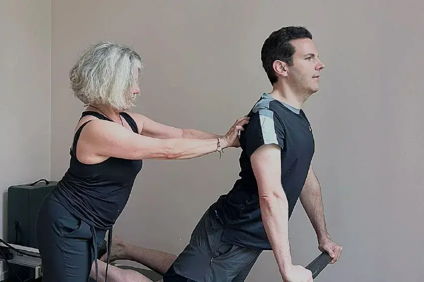 Ami Garmon, founder of Remedy, working with a client on the equipment.